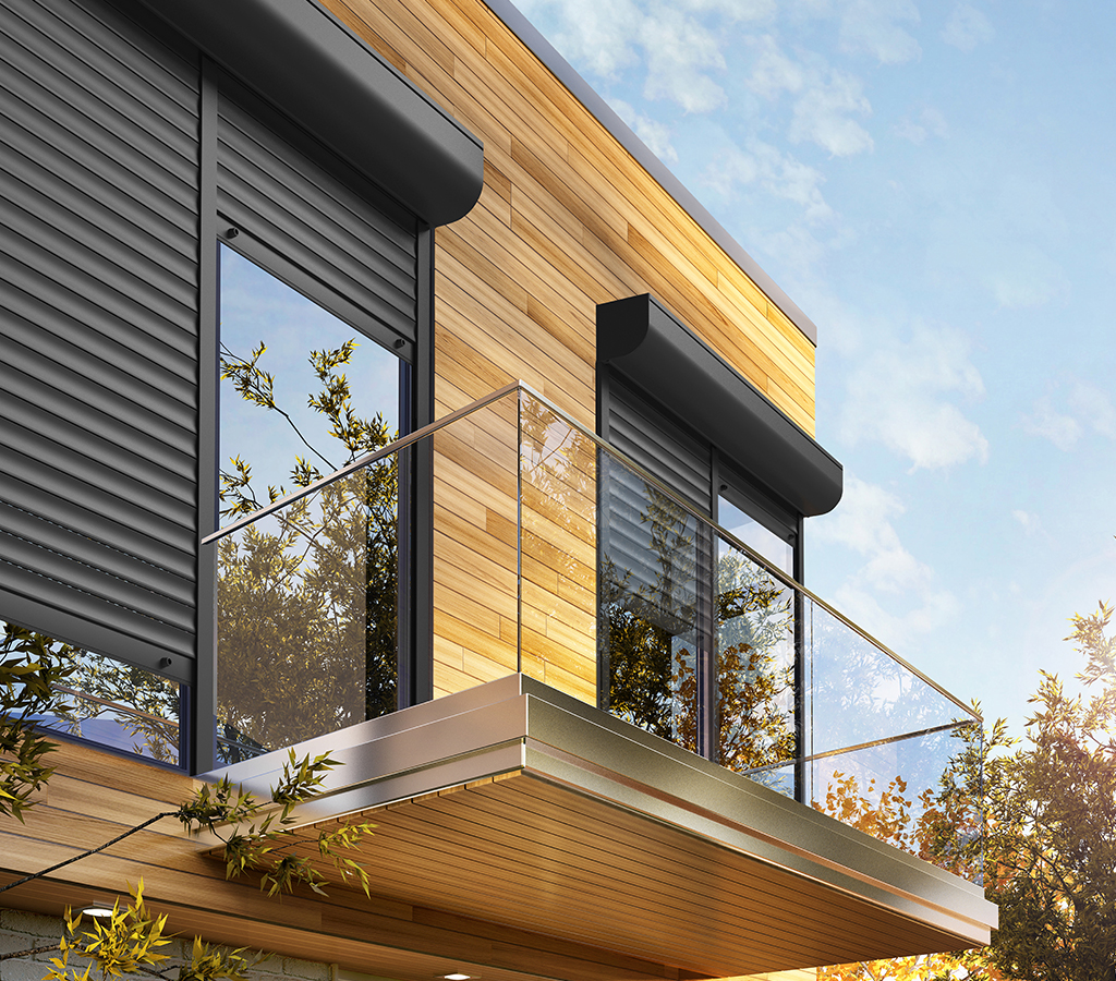 Volets roulants aluminium anthracite à caisson arrondi sur une façade bois